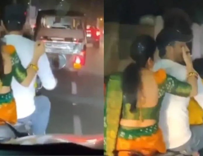 बाइक चला रहे पति को सिगरेट पिलाते पत्नी का वीडियो हुआ वायरल, लोग कर रहे हैं मिक्स्ड रिएक्शन